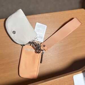 Lululemon Dual Pouch Wristlet in SOLD OUT color: PCHB/WHTO Peach Bellini/White